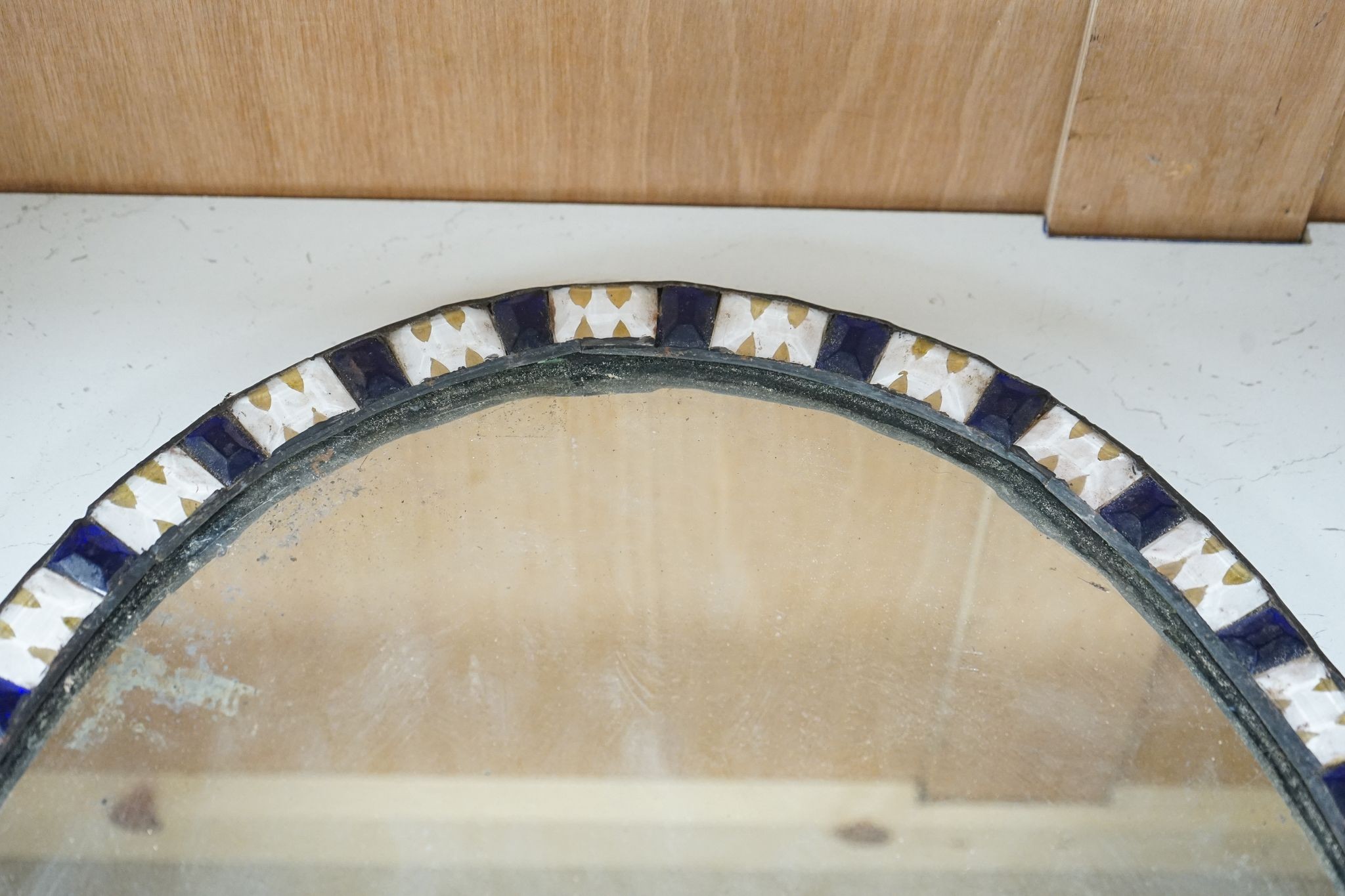 An oval Irish-style wall mirror, 56x41cm